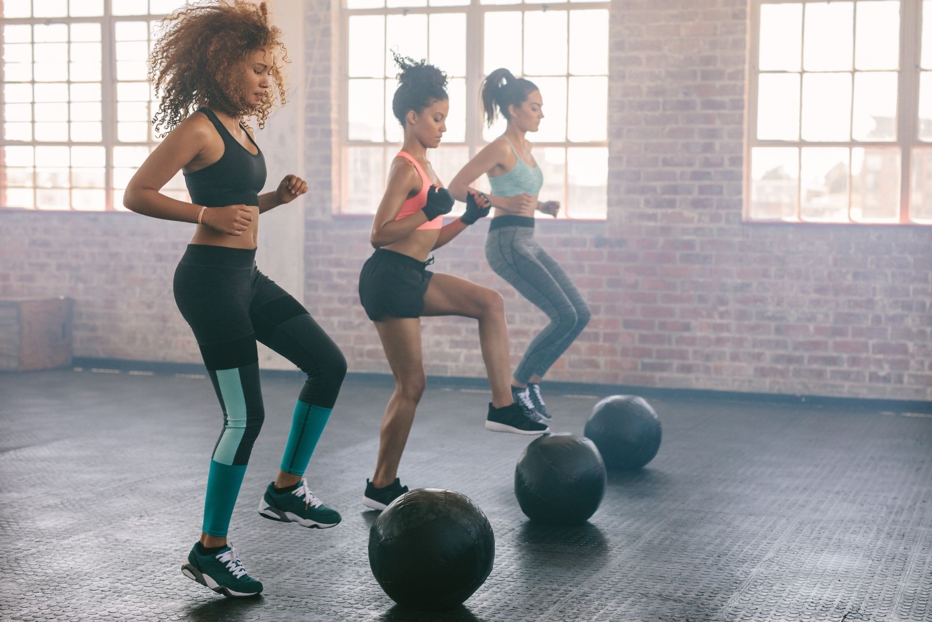 three women working out during fitness class