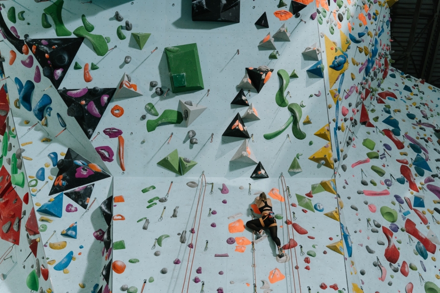 Woman Climbing a Wall