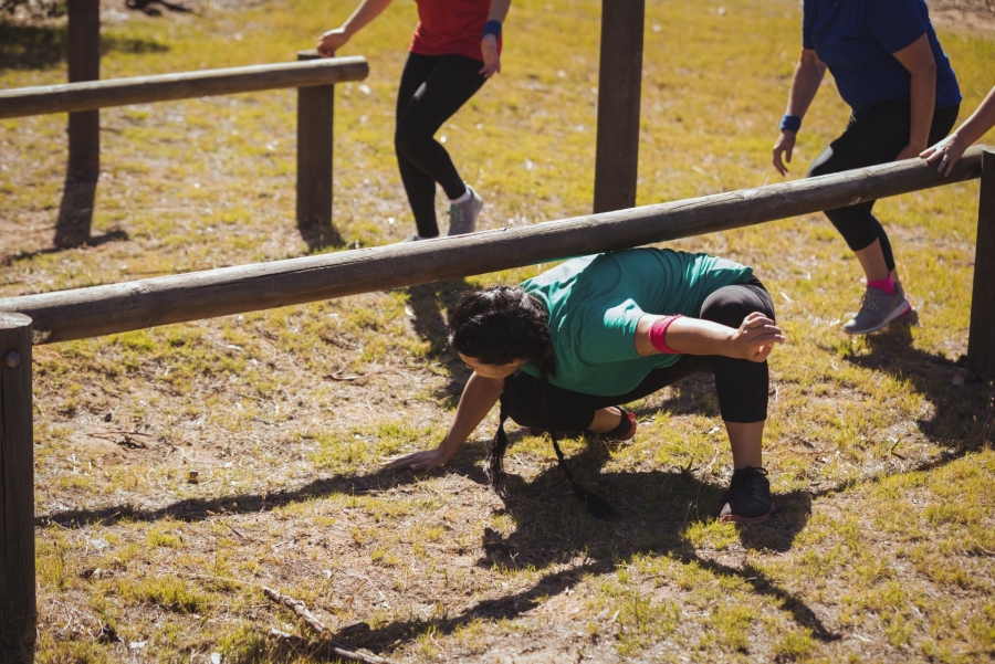 woman passes under the obstacle