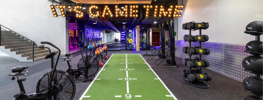 gym with yellow neon and qorkout equipment