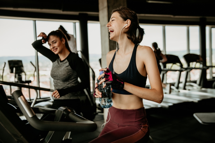 two girls on trademiles at the gym