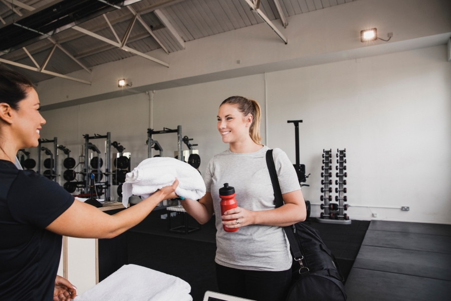 woman at the reception desk at the gym