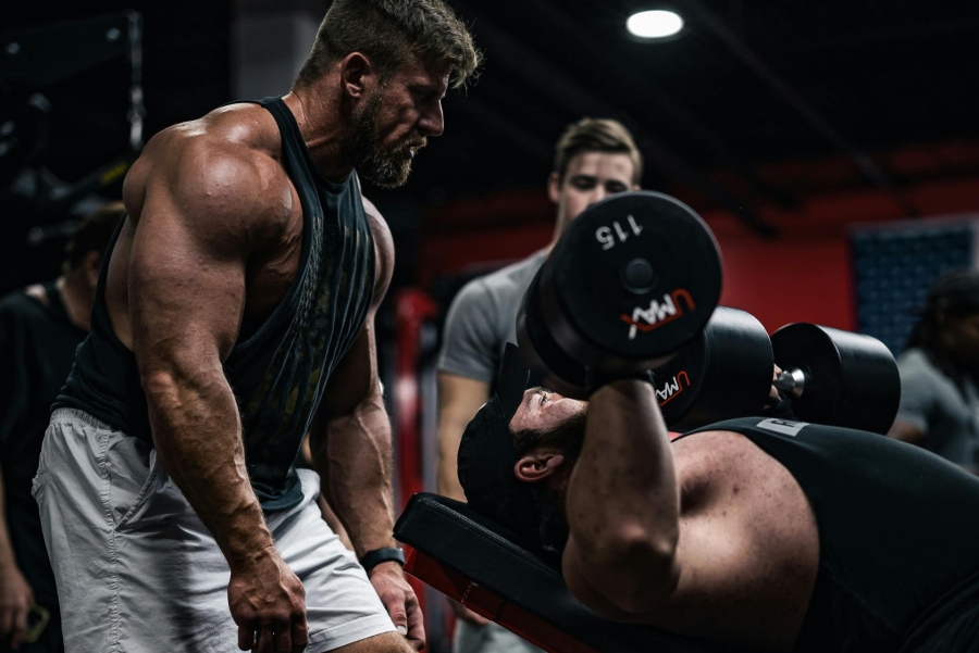 men working out in a dark gym