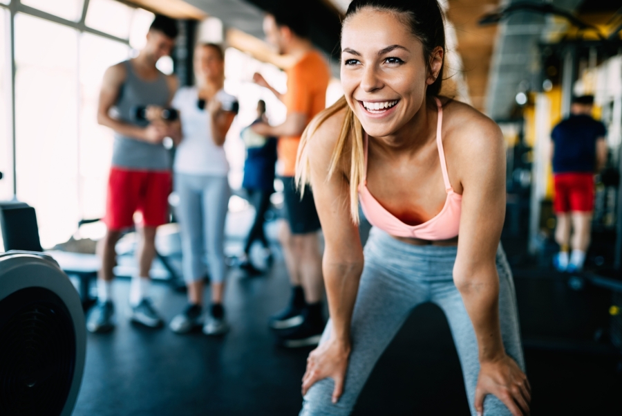 woman smiling at the gym